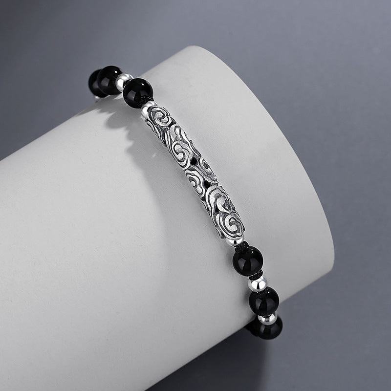 Black Onyx hand rope with silver Xiangyun carving centerpiece, featuring polished onyx and silver beads on a sleek design.